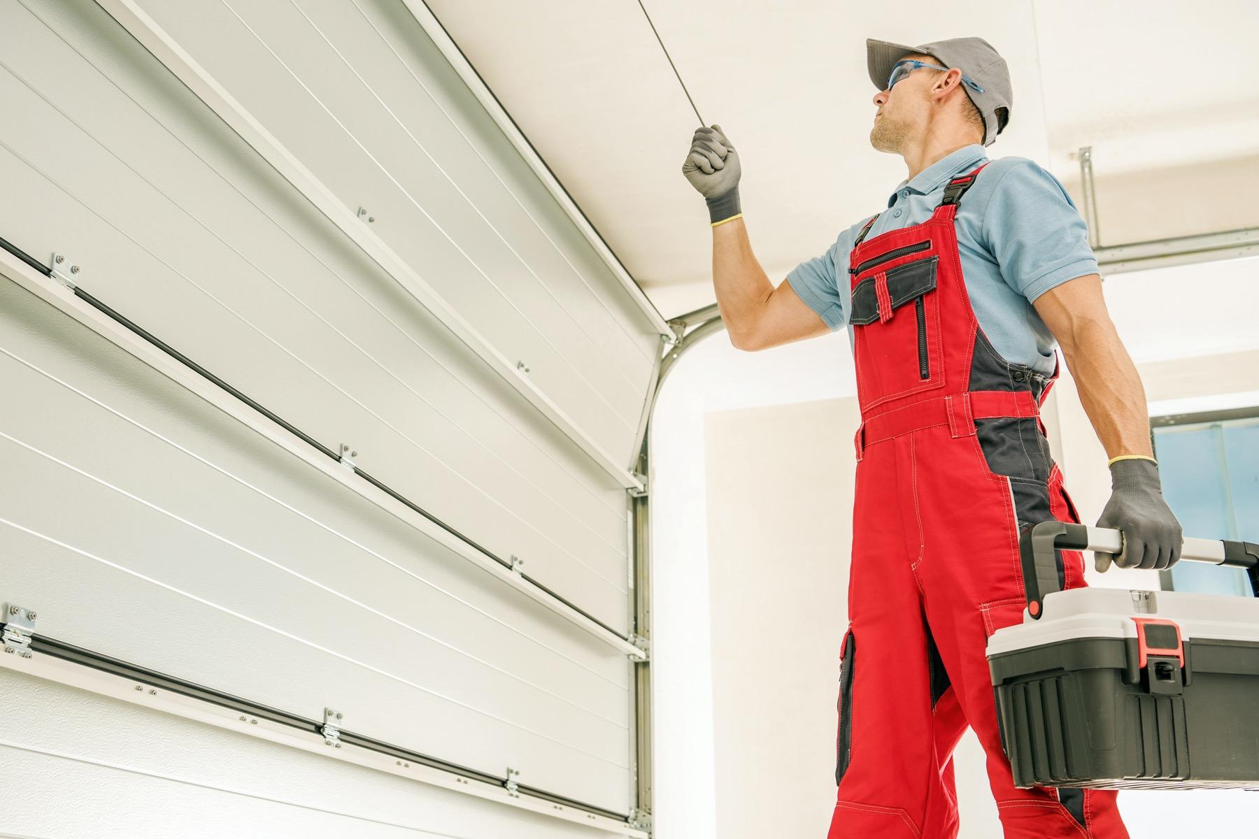 Bay Shore Garage Door technician inspecting a residential garage door